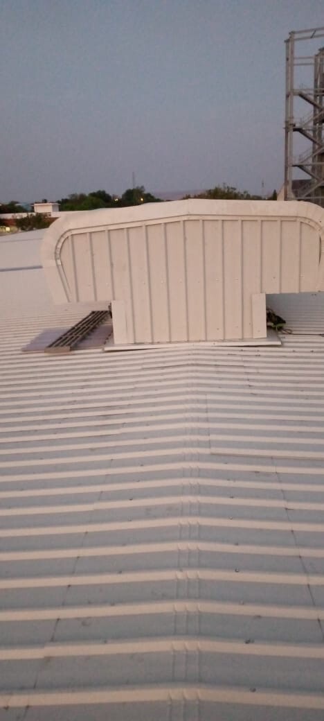 Commercial architectural roofing at Oberoi Mall, Mumbai: Specialized Kliplok roof-on-roof installation by Rishonn & Reyansh for leak-proof retail infrastructure.